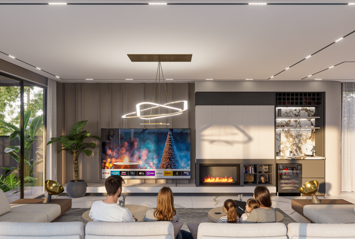 Wohnzimmer der Luxusvilla Nehirsu 7 – moderne TV-Wand, Kamin und familienfreundliches Interieur.