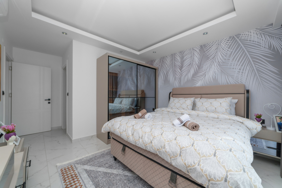 Bright master bedroom in a modern 3-room apartment in Mahmutlar